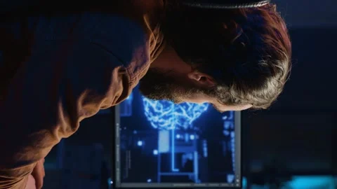 Developer uses computer to update artificial intelligence neural networks 動画素材 265108168