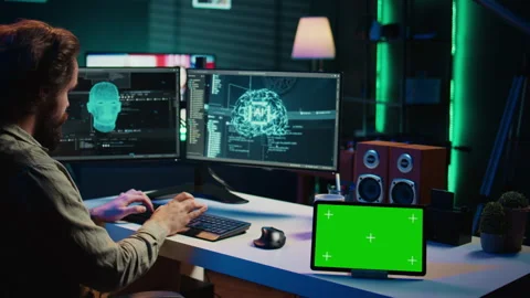 Developer using green screen tablet updating artificial intelligence Stock Footage 267046029