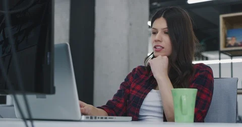 Developer using laptop computer while writing programming code at modern crea Stock Footage 113961603