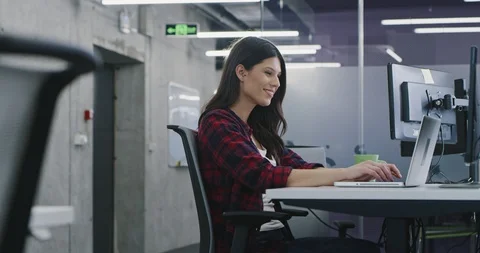 Developer using laptop computer while writing programming code at modern crea Stock Footage 114102852