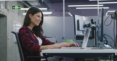 Developer using laptop computer while writing programming code at modern crea Stock Footage 114191122