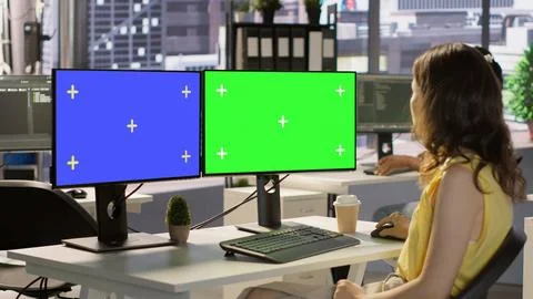 Developer using multi monitor isolated screen PC in office Stock Photos