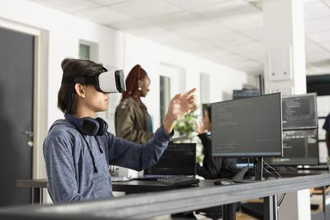 Developer using virtual reality headset controlling digital interfaces Stock Photos