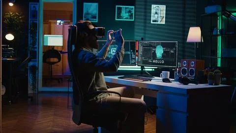 Developer using VR headset panicking after sentient AI gains autonomy Stock Photos