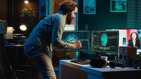 Developer using VR headset panicking after sentient AI gains autonomy Stock Photos