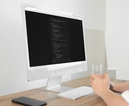 Developer vibe coding using dark mode artificial intelligence AI assistant .. Photos