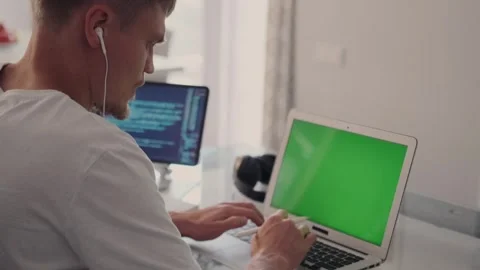 Developer on video call, tablet displays code, discussing app improvements. Stock Footage 299895247