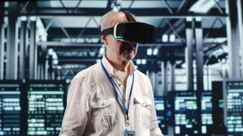 Developer with vr headset in data center Stock Footage 247902502