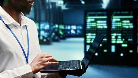 Developer walking through mainframe rows Stock Footage 246714130