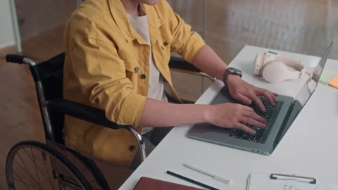 Developer in Wheelchair Working on Wireless Laptop Stock Footage 265072617