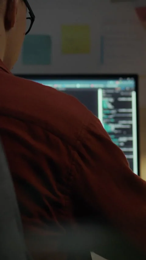 Developer working on algorithm optimization at a tech workspace in the eveni Stock Footage 331570002