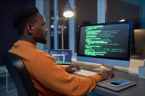 Developer working with computer codes Stockfoto's