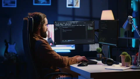 Developer working on fixing database errors while working from home Stock Footage 265512206