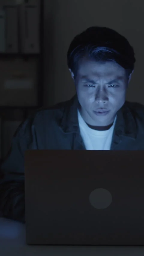 Developer Working on Laptop at Nighttime to Meet Deadline Stock Footage 256975892