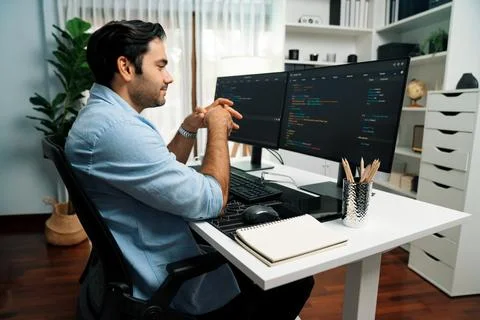 Developer working software development coding two computer code screen. Surmise. Stock Photos