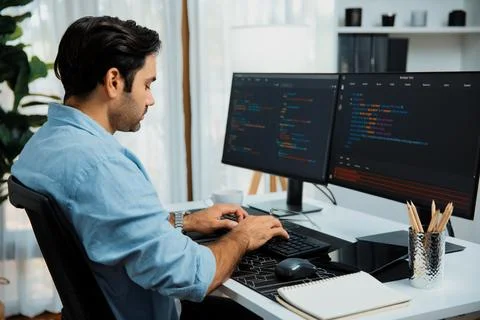 Developer working software development coding two computer code screen. Surmise. 스톡 사진