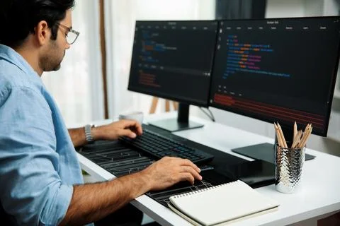 Developer working software development coding two computer code screen. Surmise. 写真素材