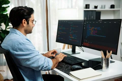 Developer working software development coding two computer code screen. Surmise. 스톡 사진