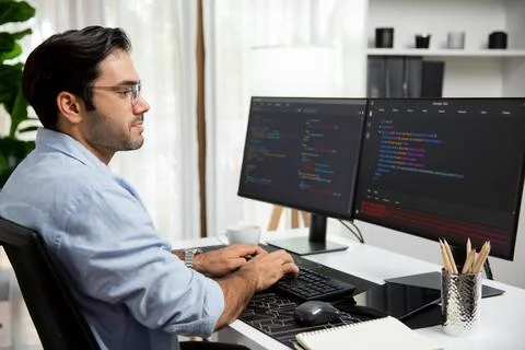 Developer working software development coding two computer code screen. Surmise. 写真素材