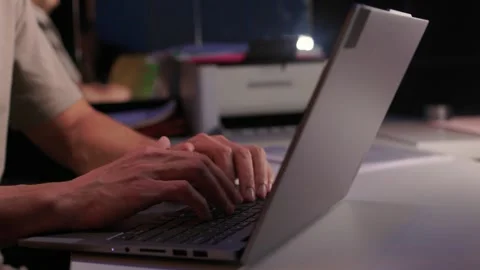 Developer working under dim light. Night coding session with glowing screen and Stock Footage 346244805