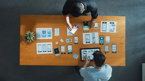 Developer working on Ux ui design while partner working together. Convocation. Foto stock