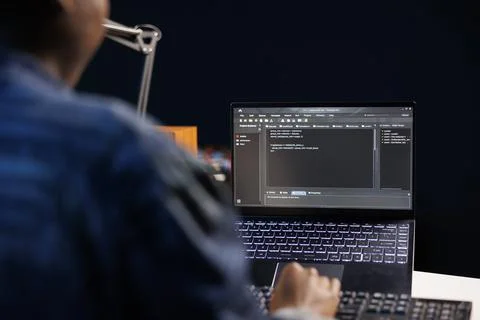 Developer works on data center on laptop Stock Photos