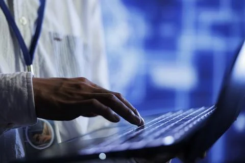 Developer writes AI code on laptop 스톡 사진