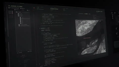 Developer writes programming code to intercept information from satellite Stock Footage 312022097