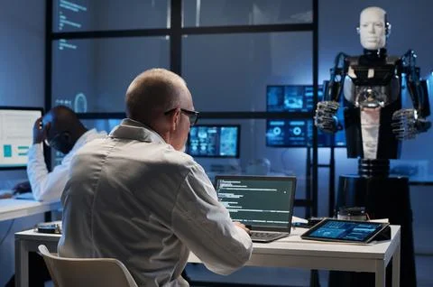 Developer writing codes on laptop in office 스톡 사진