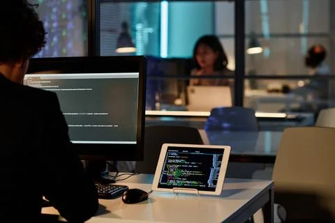 Developer writing security codes on computer for program Stockfoto's