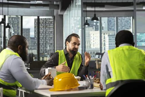 Developers and architects working on real estate investment plan Stock Photos
