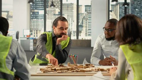 Developers and architects working on real estate investment plan Stock Photos