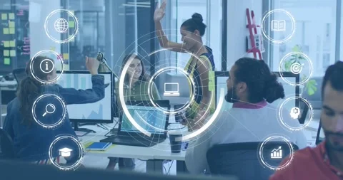 Developers celebrating project success by high-fiving around laptop with Stock Footage 318046199
