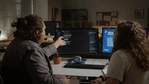 Developers Celebrating Successful Programming with High Five in Office Stock Footage 348154192