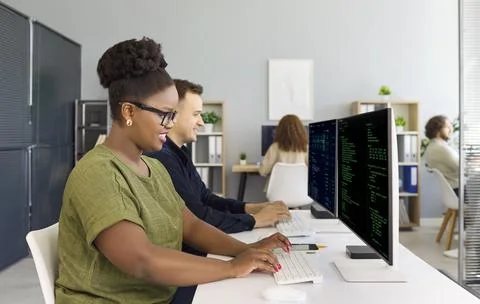 Developers coding at computers in office with programmers teamwork for startup 스톡 사진