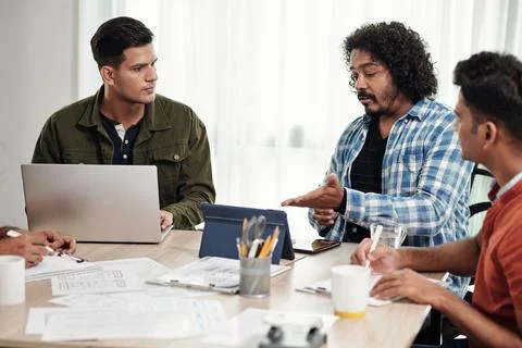 Developers Discuss Project Progress Stock Photos