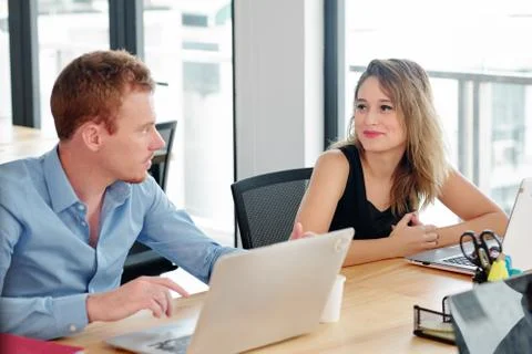 Developers discussing programming code Foto stock