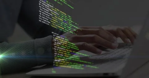 Developer's hands typing laptop keyboard, initiating diagonal green code 写真素材