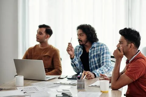 Developers Listening to Collegue Stock Photos