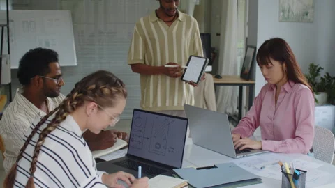 Developers Listening to Product Manager Showing Application Interface Stock Footage 270147404