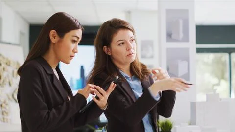 Developers measuring 3d building model to create blueprints Stock Photos