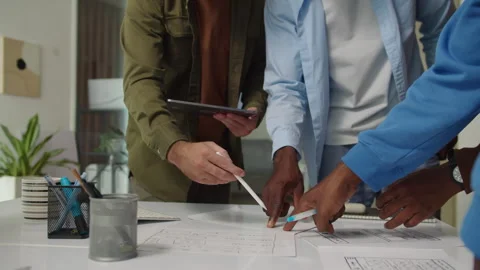 Developers Meeting at Office to Discuss Interface of App near Table Stock Footage 277413676
