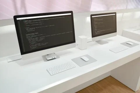 Developer's office. Two computer displays with code editors. Stockfoto's