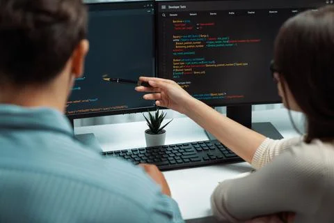 Developers program coding discussing website planning software. Postulate. Stock Photos