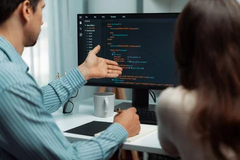 Developers program coding discussing website planning software. Postulate. Stock Photos