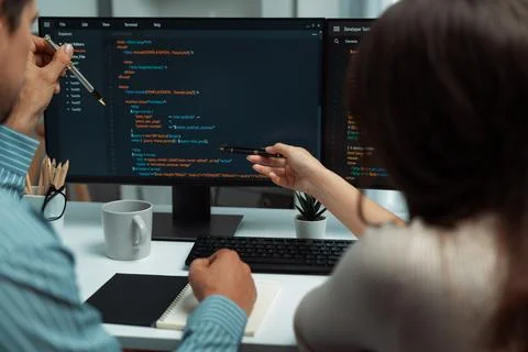 Developers program coding discussing website planning software. Postulate. Stock Photos