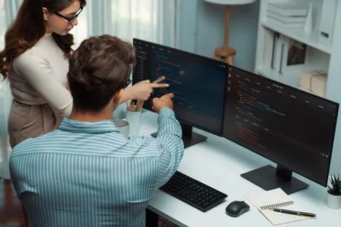 Developers program coding discussing website planning software. Postulate. 库存照片