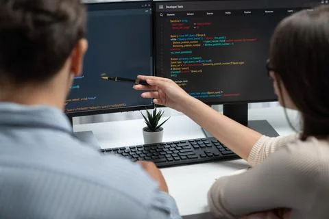 Developers program coding discussing website planning software. Postulate. Stock Photos