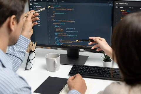 Developers program coding discussing website planning software. Postulate. Stockfoto's