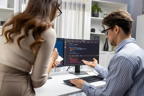 Developers program coding discussing website planning software. Postulate. Stock Photos